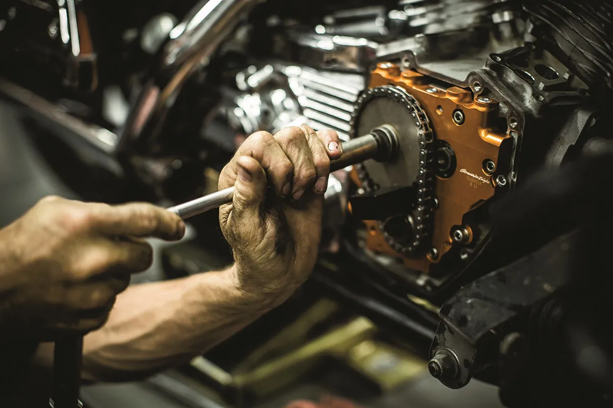 Mechanic working on engine gear